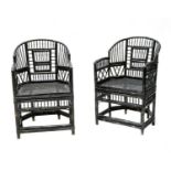 A pair of 'Brighton Pavilion' ebonised bamboo elbow chairs