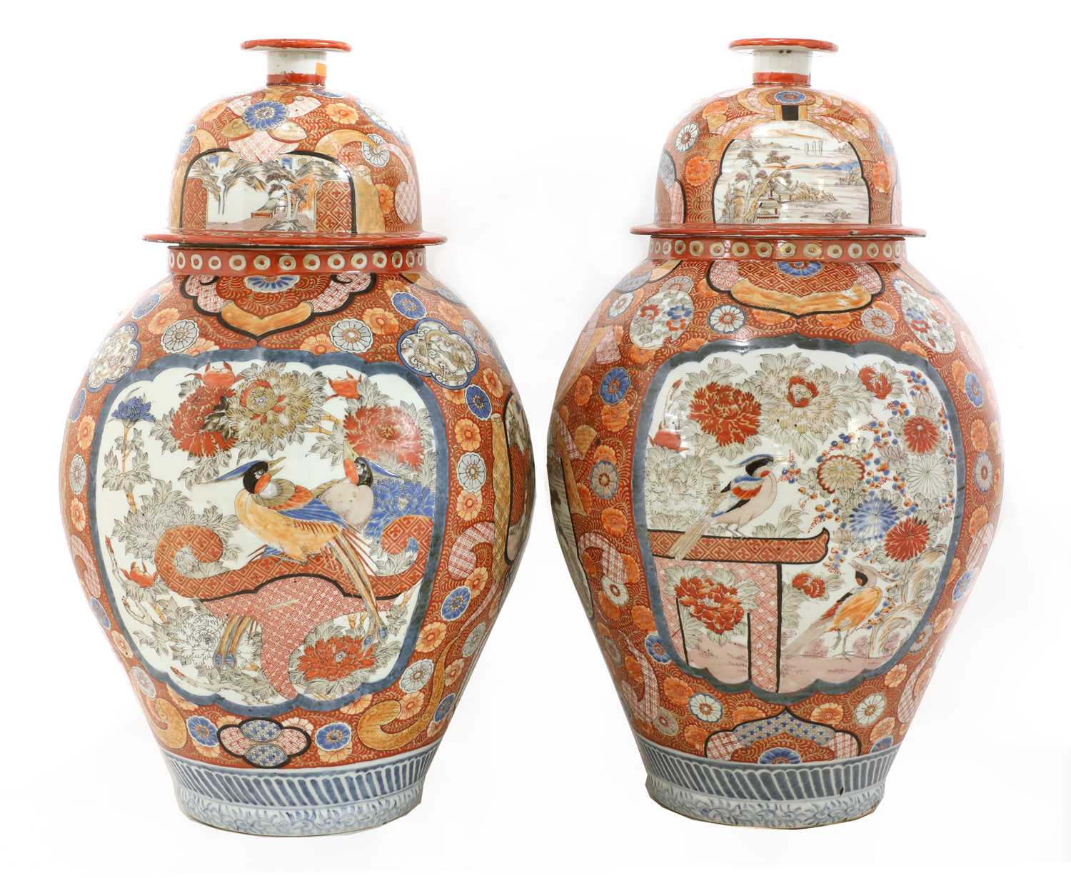 A large pair of Imari vases and covers,