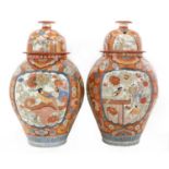 A large pair of Imari vases and covers,