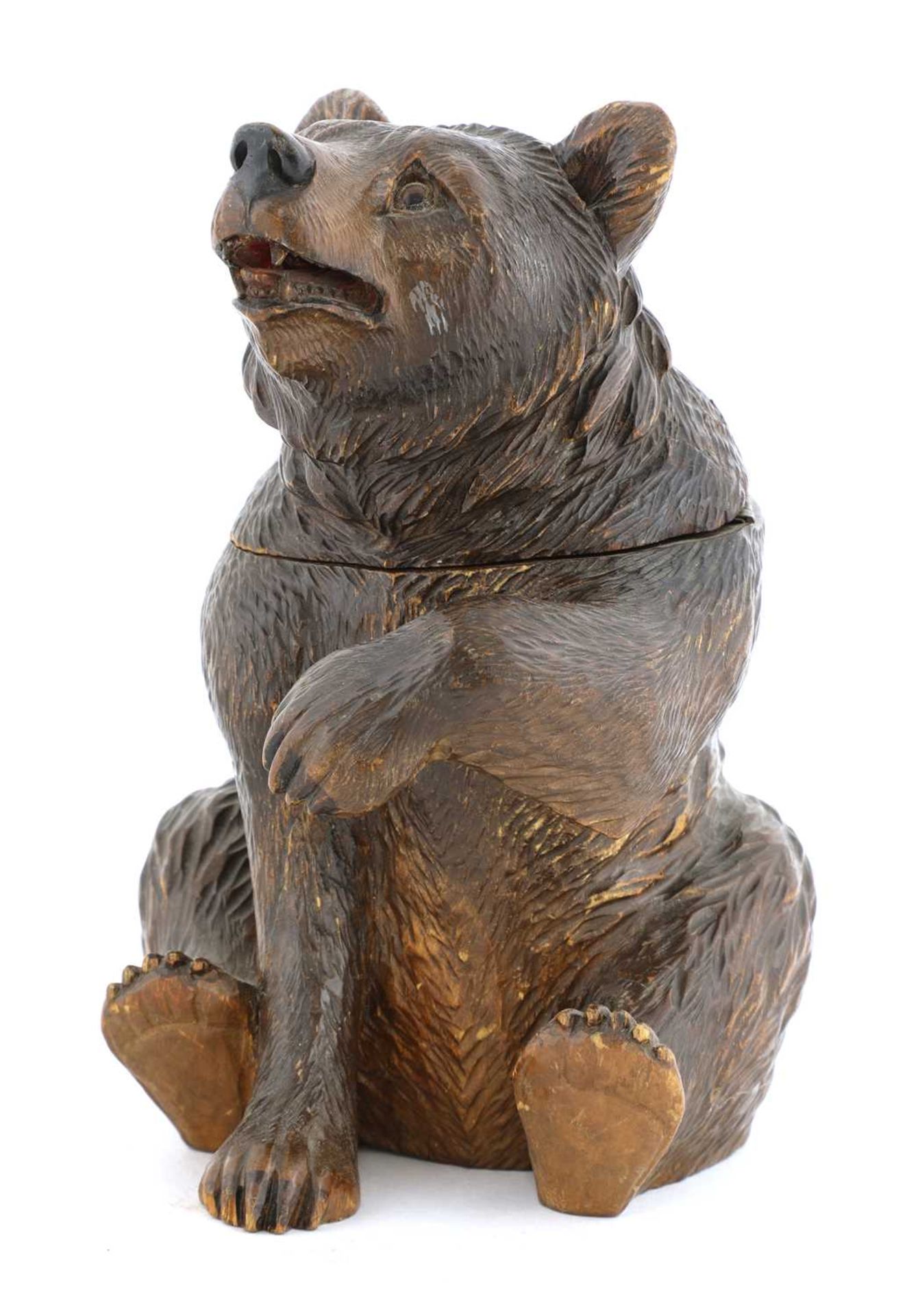 A Black Forest carved wooden bear tobacco jar,