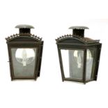 A pair of painted and pressed metal wall lights,