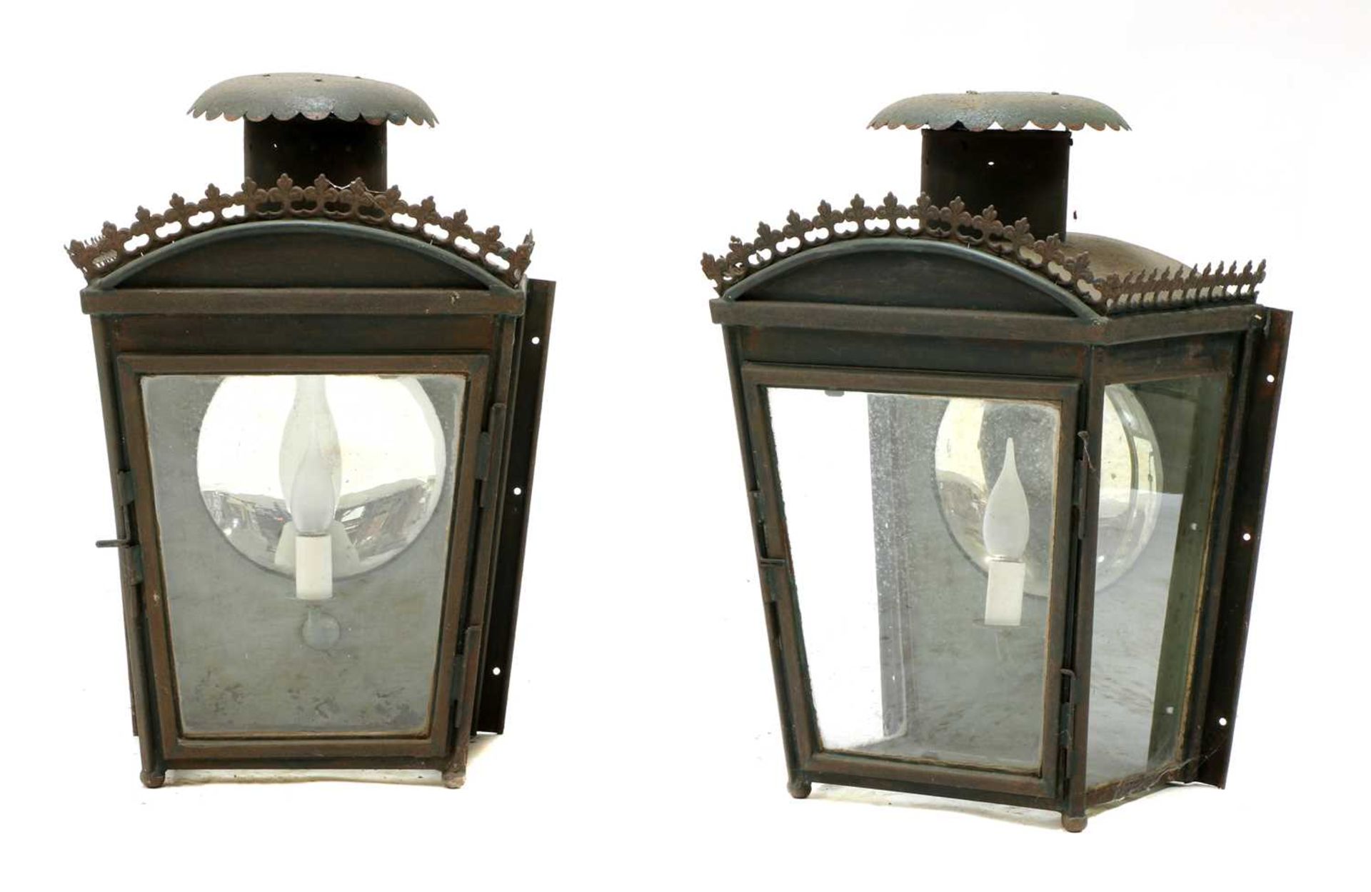 A pair of painted and pressed metal wall lights,