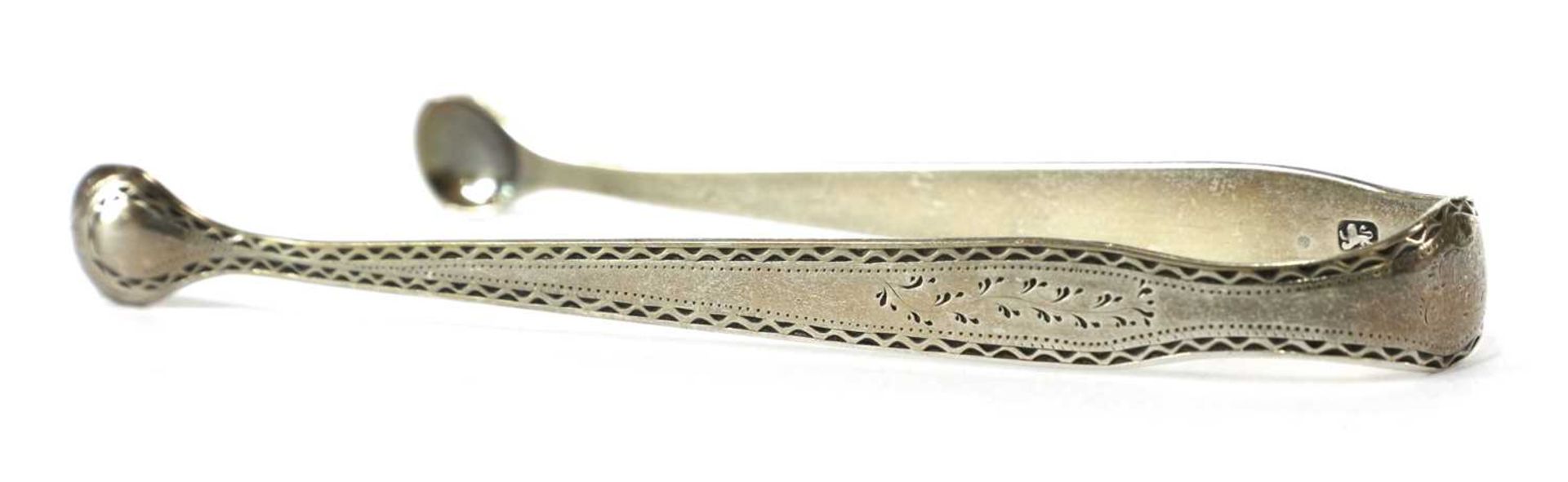 A pair of George III silver sugar tongs, - Image 15 of 33