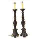 A pair of Continental giltwood and painted altar candlesticks,