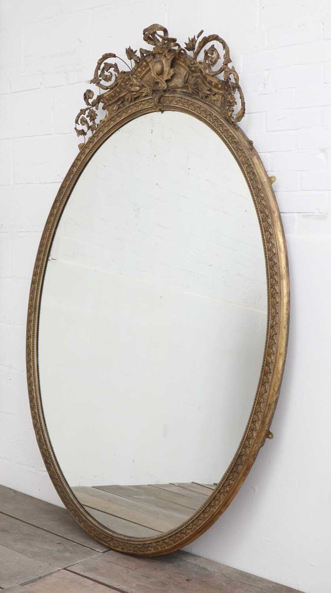 A large gilt overmantel mirror,