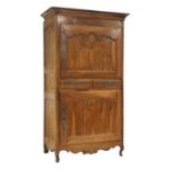 A French fruitwood cupboard,