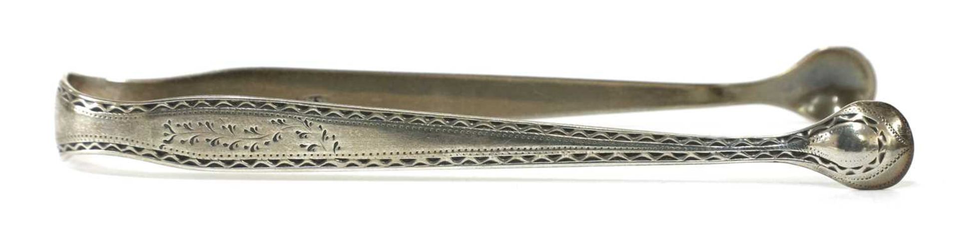 A pair of George III silver sugar tongs, - Image 14 of 33