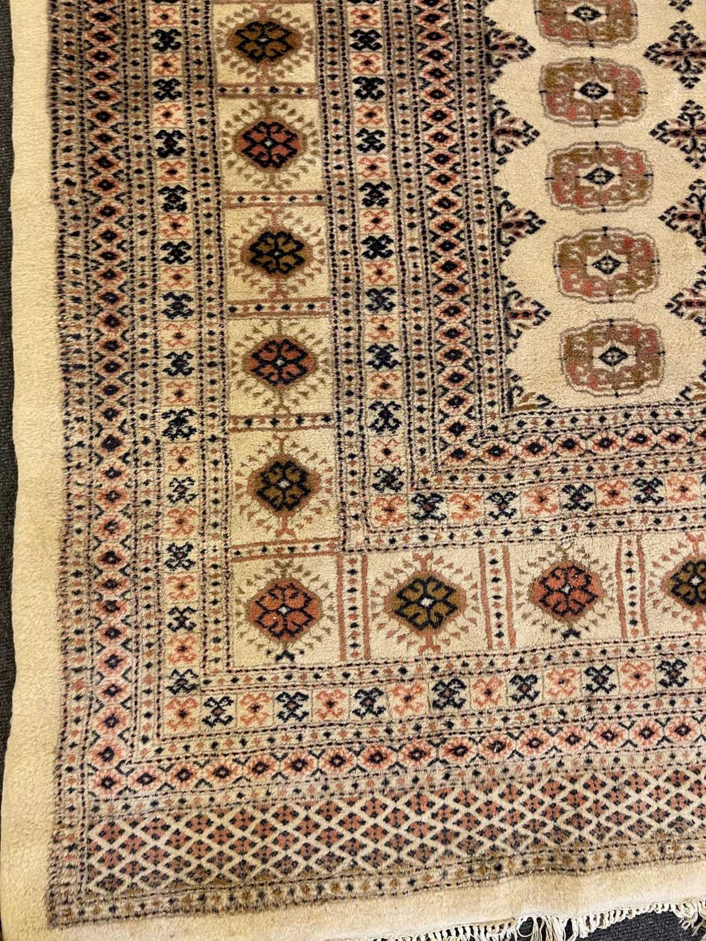 A Bokhara design carpet, - Image 5 of 13