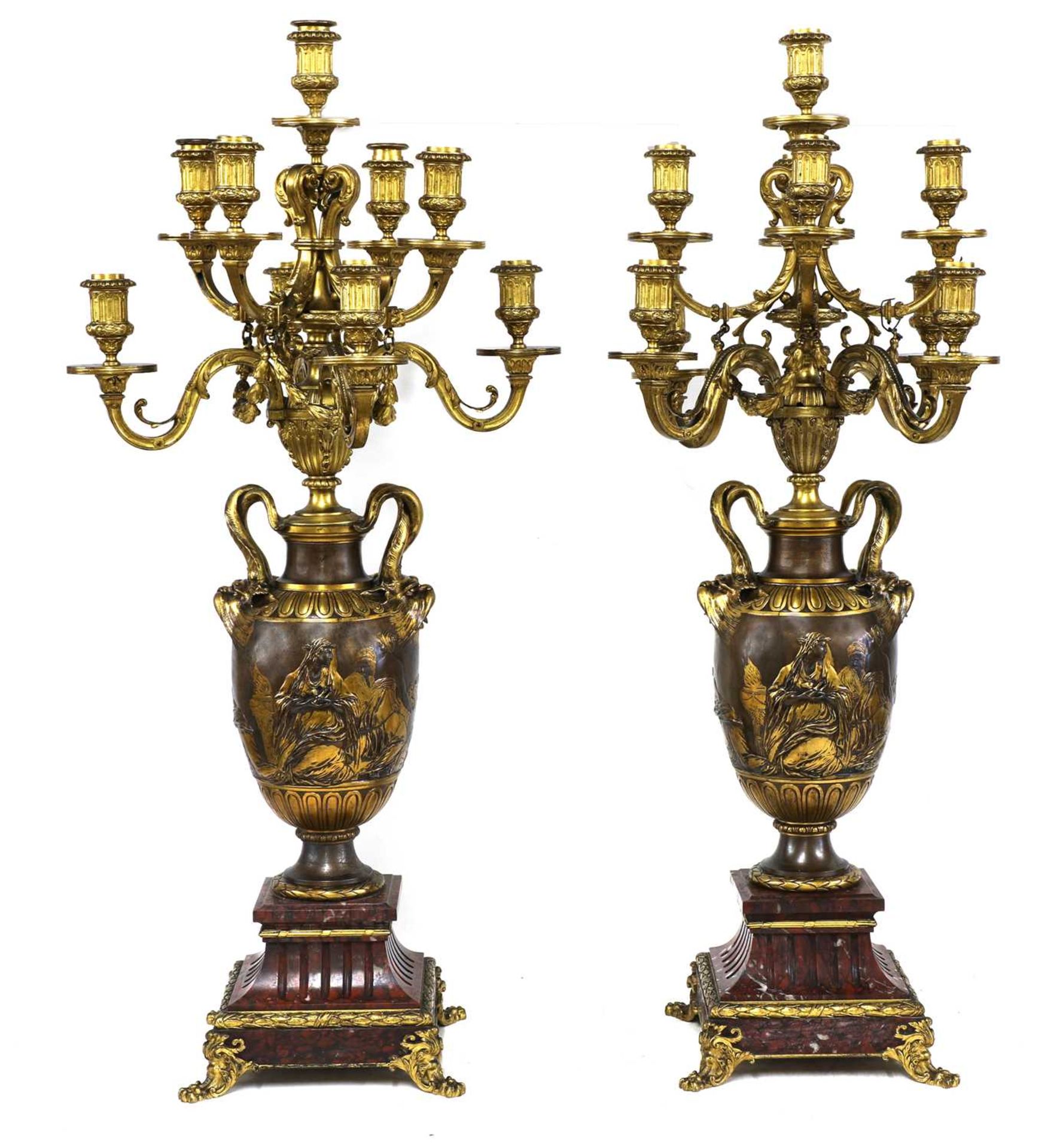 A pair of marble, gilt and patinated bronze candelabra,