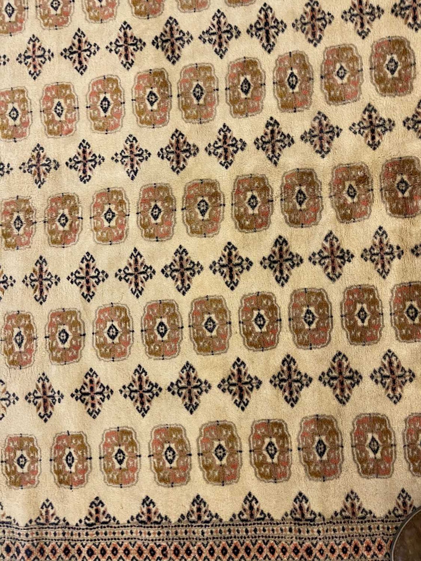 A Bokhara design carpet, - Image 10 of 13