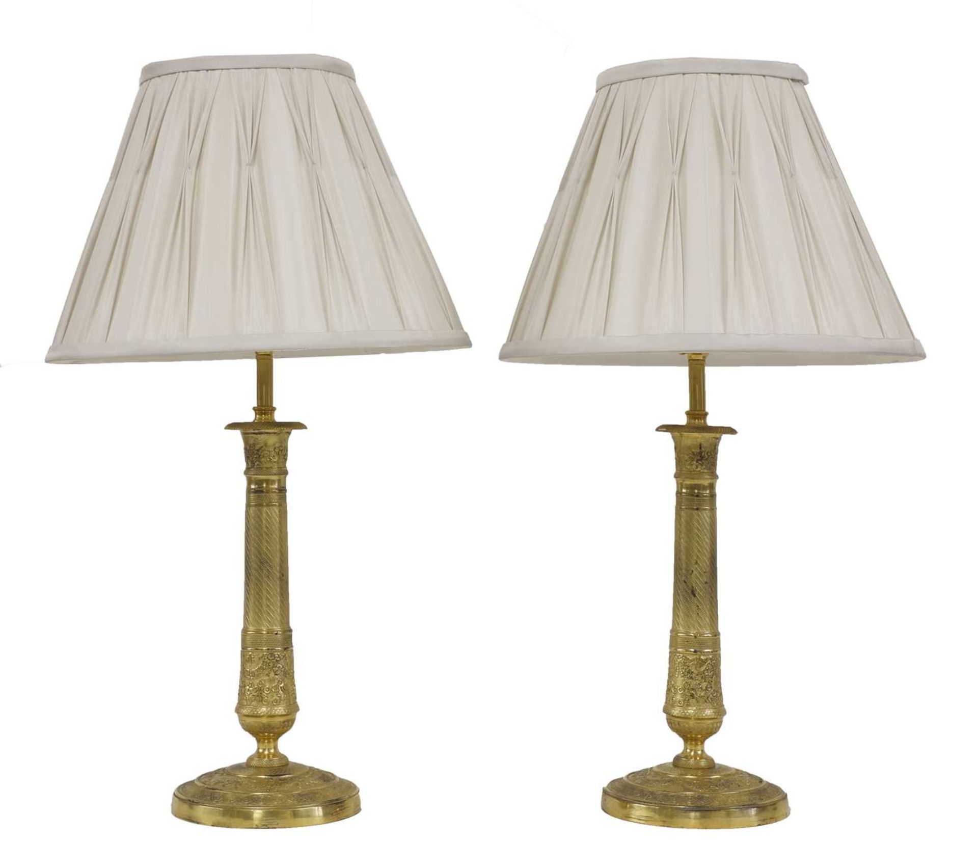 A pair of French Empire-style ormolu table lamps,