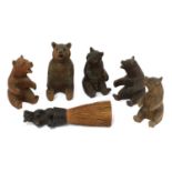 A group of five carved wooden Black Forest bears,