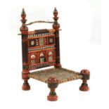 A Rajasthani polychrome painted low chair,