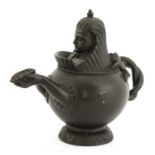 A Regency black basalt teapot,