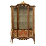 A good Louis XV-style rosewood serpentine vitrine,