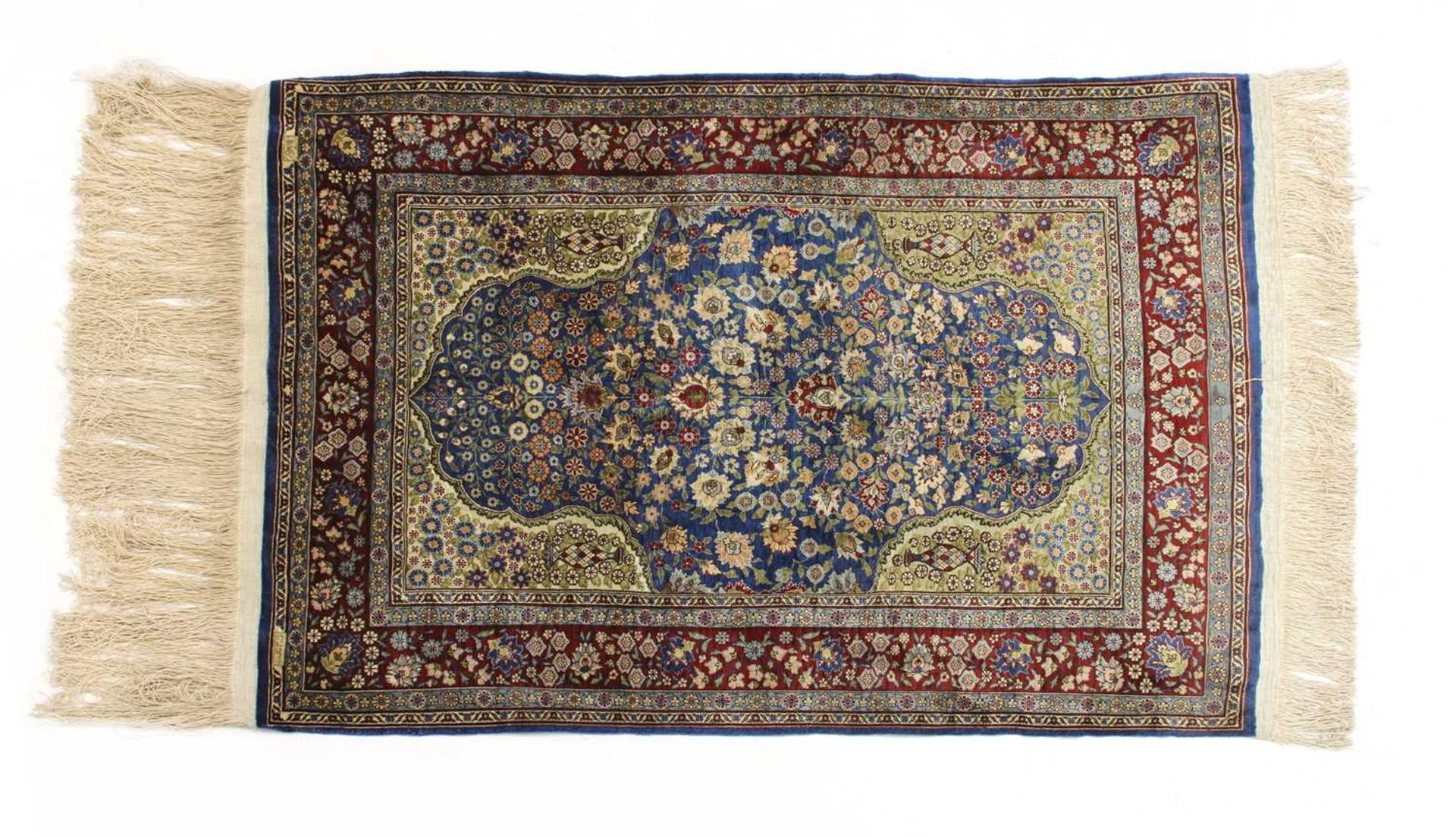 A Turkish silk and metal Hereke rug,