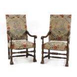 A pair of Continental stained beech armchairs