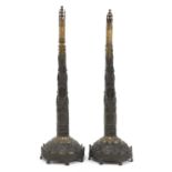 A large pair of Victorian bronze face screen stands,
