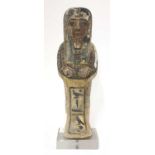 An Egyptian carved and polychrome painted wooden shabti figure,