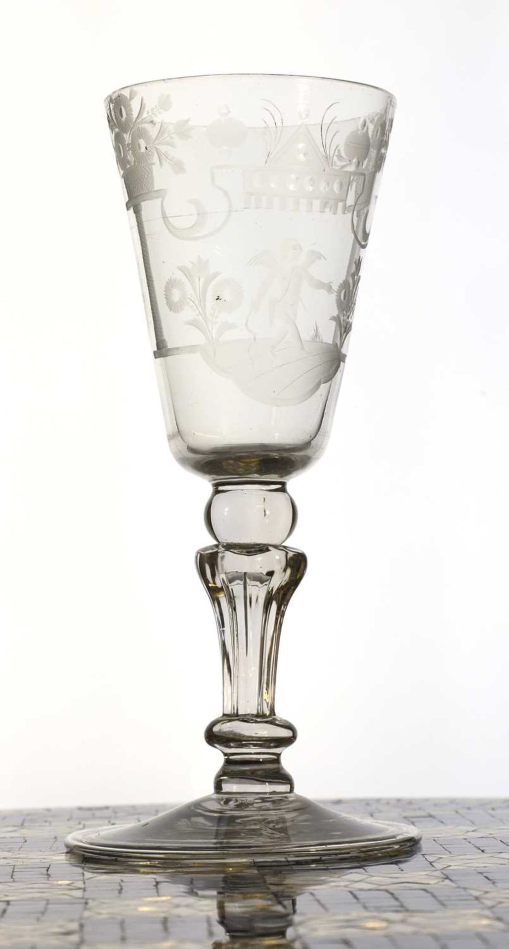 An engraved glass goblet,