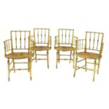 A set of four painted Regency-style elbow chairs