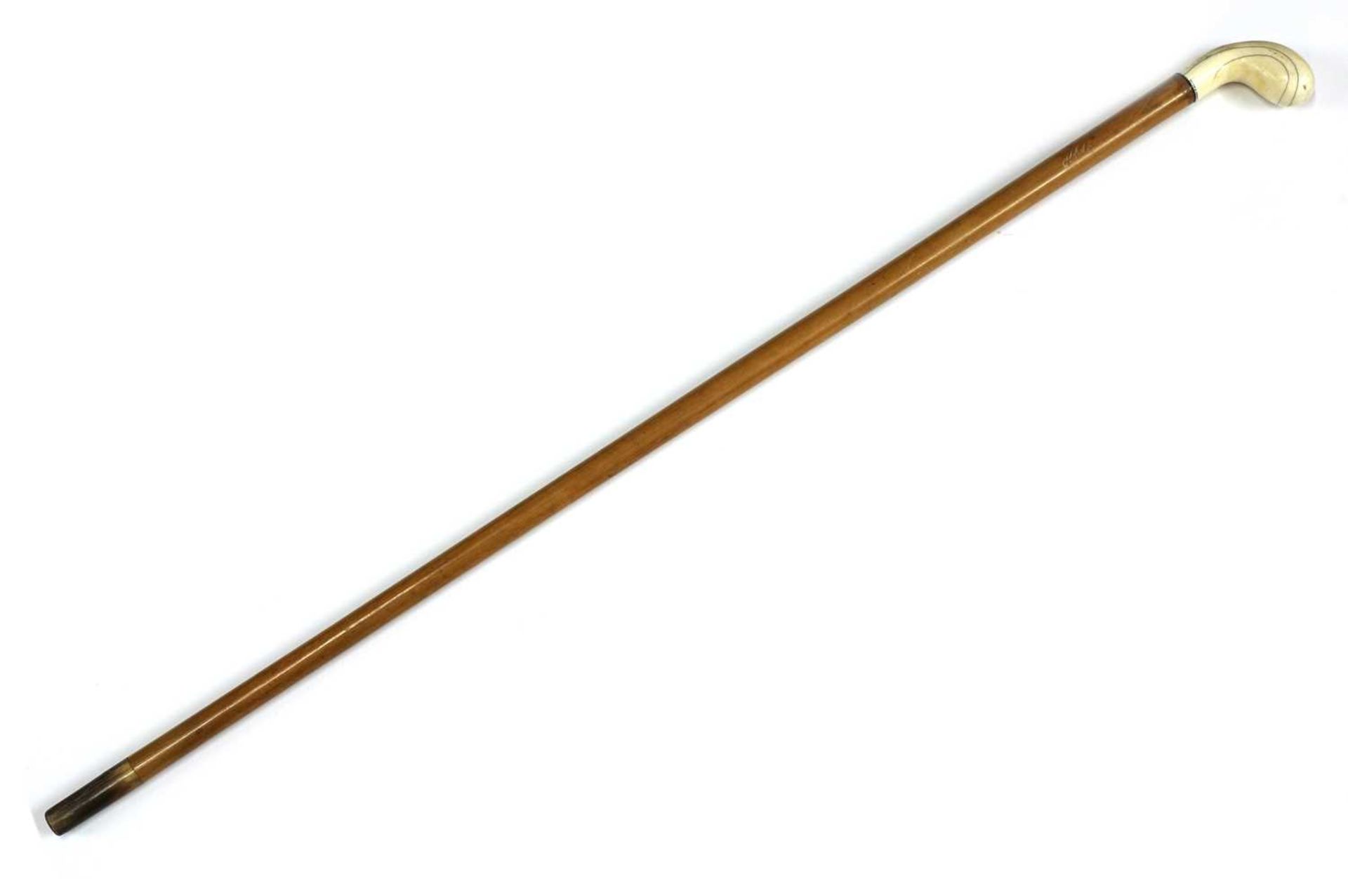 An ivory-handled walking stick,