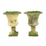 A pair of composite stone campana garden urns,