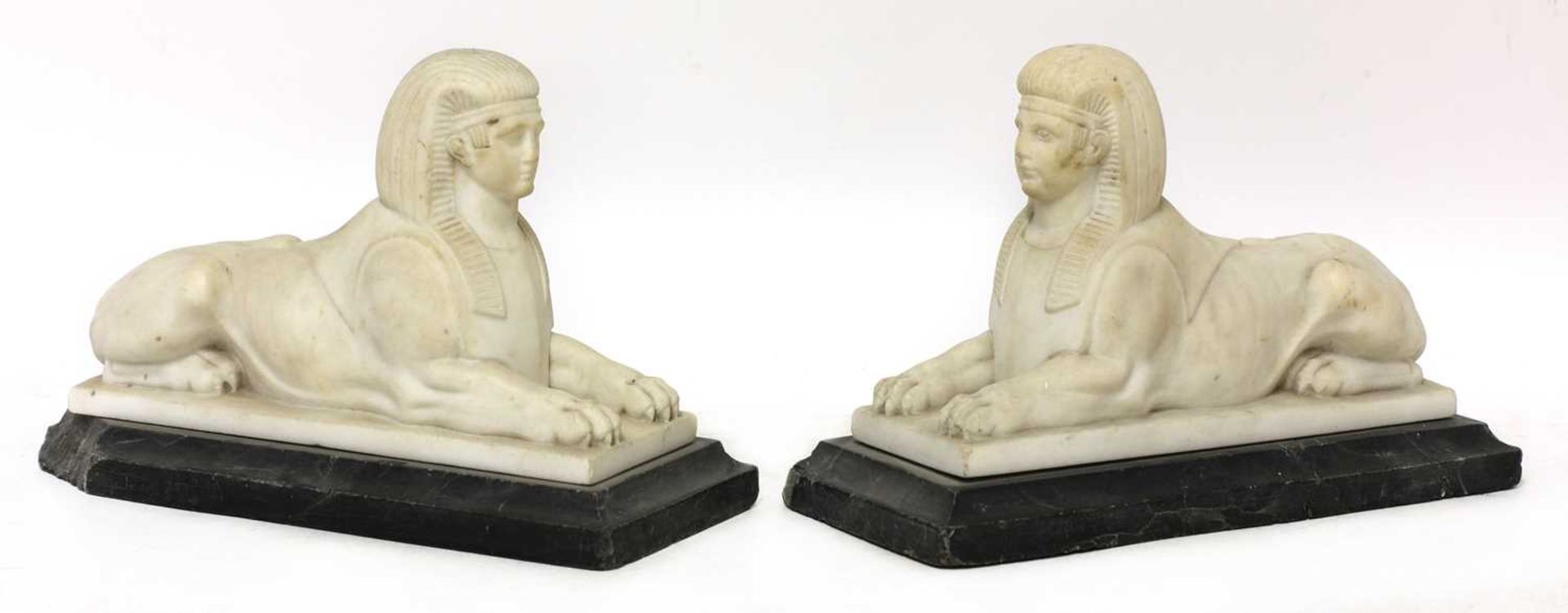 A pair of carved marble sphinx,