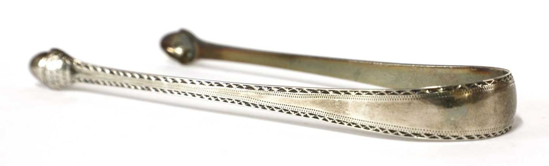 A pair of George III silver sugar tongs, - Image 19 of 33