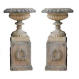 A pair of blush terracotta garden urns,