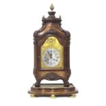 A French mahogany and brass inlaid table clock on stand