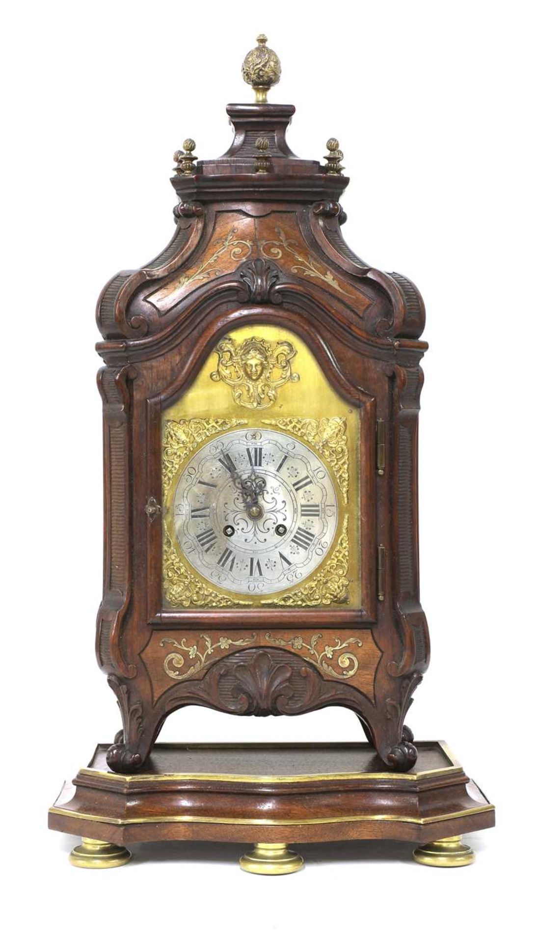 A French mahogany and brass inlaid table clock on stand