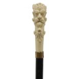 An ivory and ebonised walking stick,