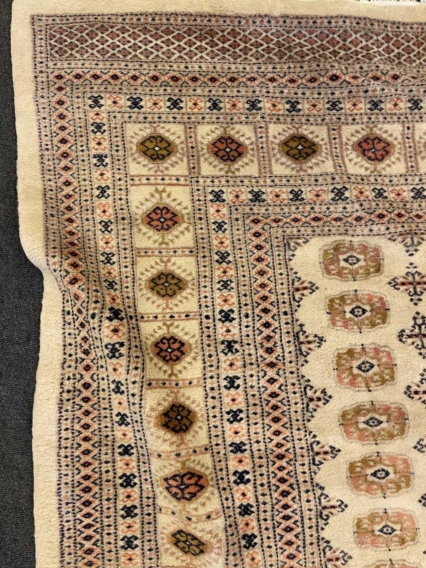 A Bokhara design carpet, - Image 12 of 13