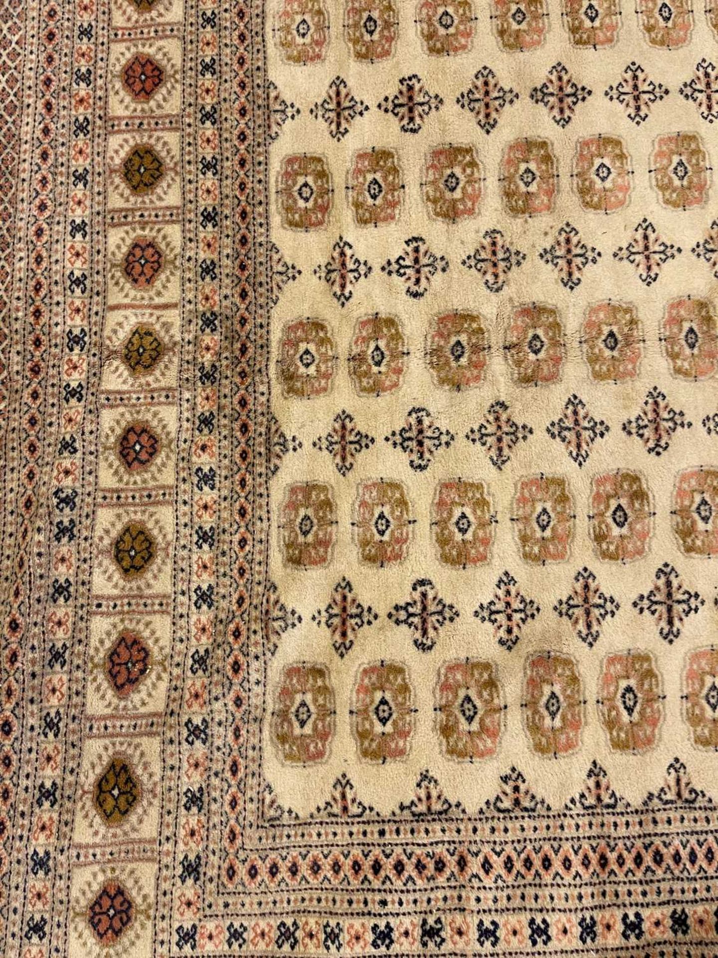 A Bokhara design carpet, - Image 11 of 13