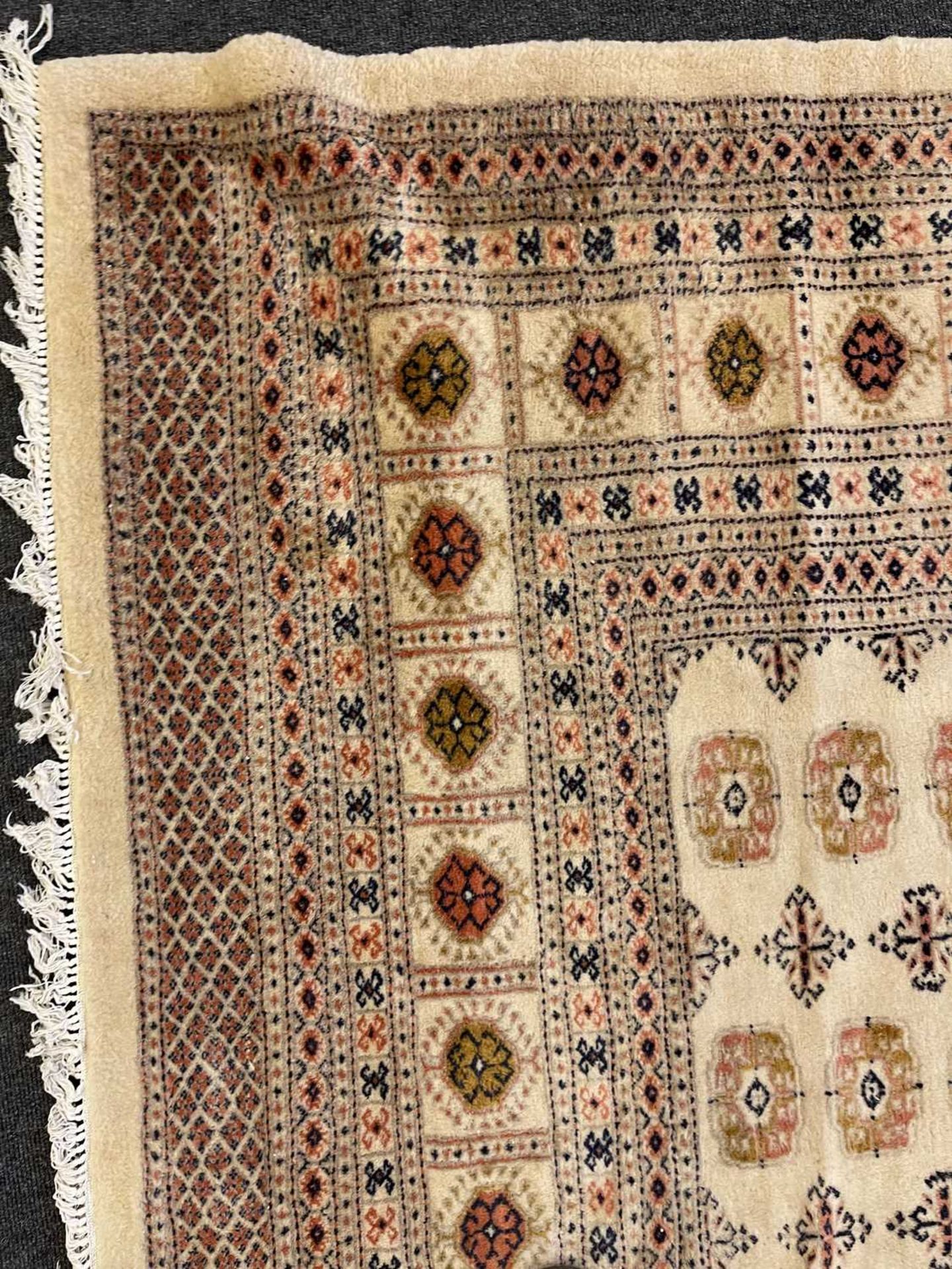 A Bokhara design carpet, - Image 7 of 13