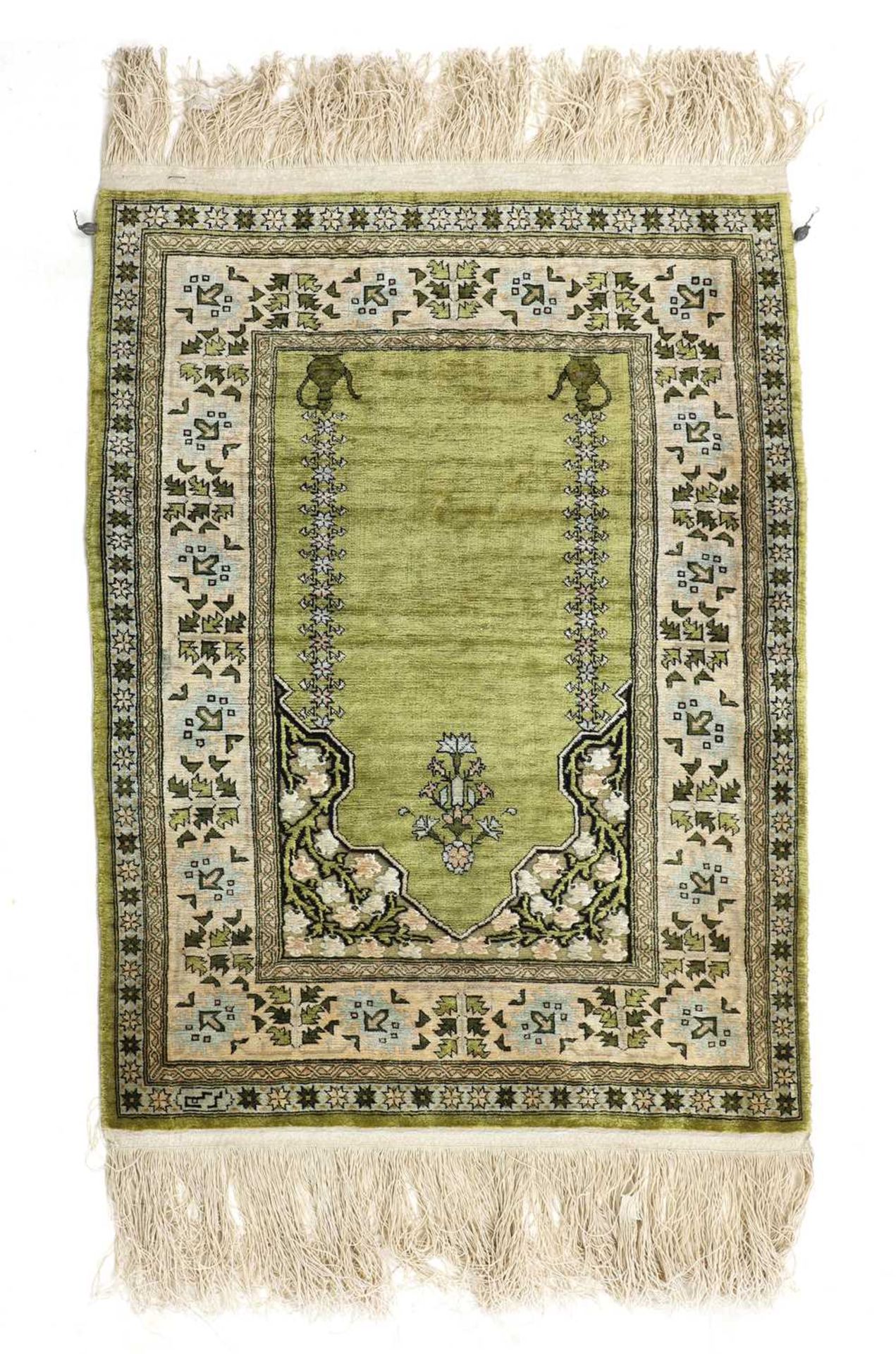 A small Turkish Hereke and gold-coloured metal rug,