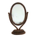 An Anglo-Indian carved padouk or rosewood dressing mirror