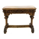 A carved oak centre table,