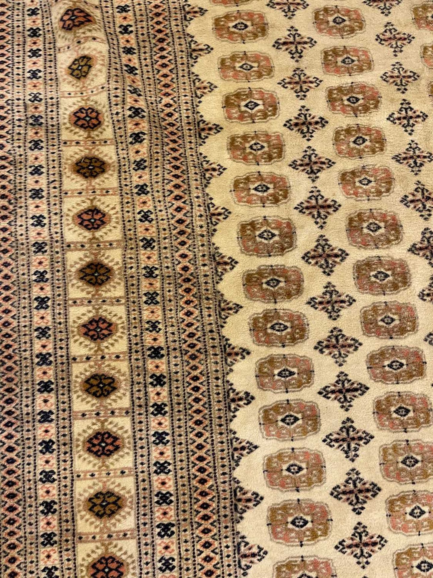 A Bokhara design carpet, - Image 13 of 13