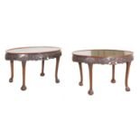 A near pair of oval mahogany silver tables,