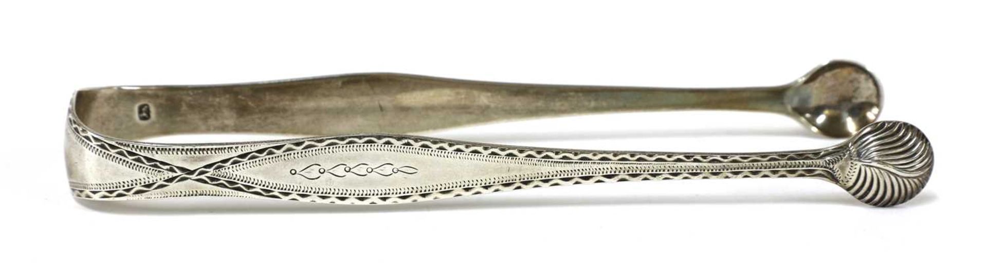 A pair of George III silver sugar tongs, - Image 10 of 33