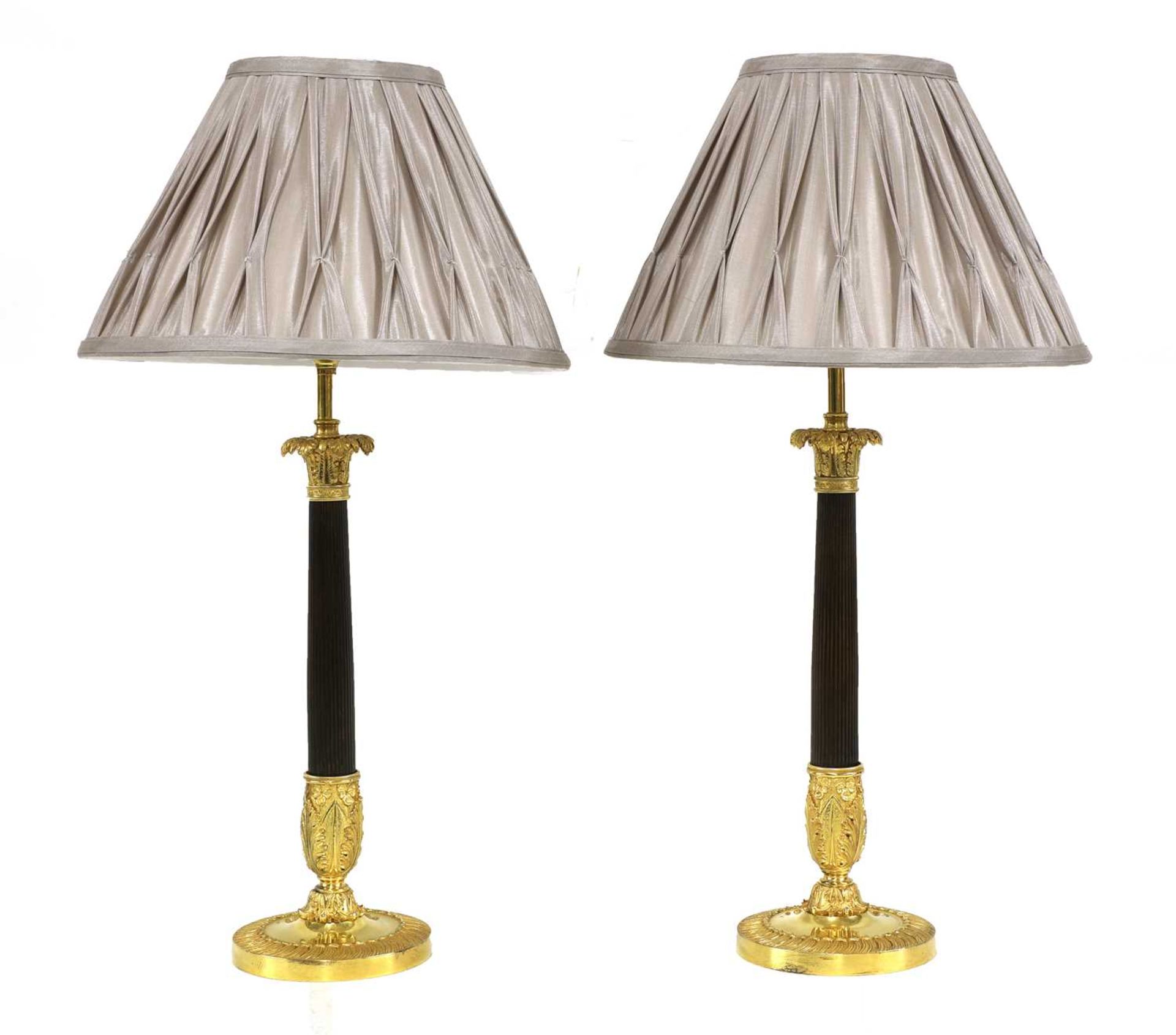 A pair of French Empire-style gilt-bronze and bronze table lamps,