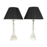 A pair of moulded glass column table lamps,