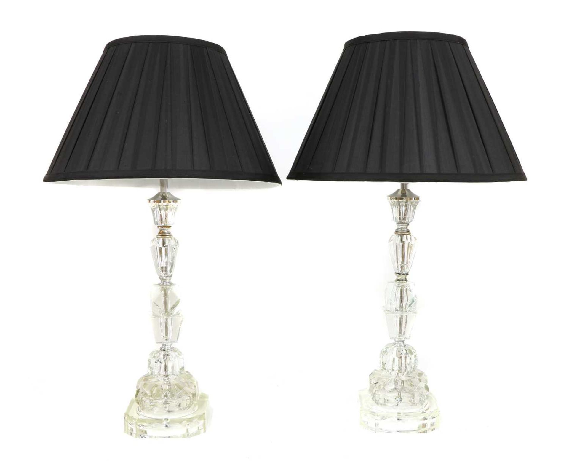 A pair of moulded glass column table lamps,