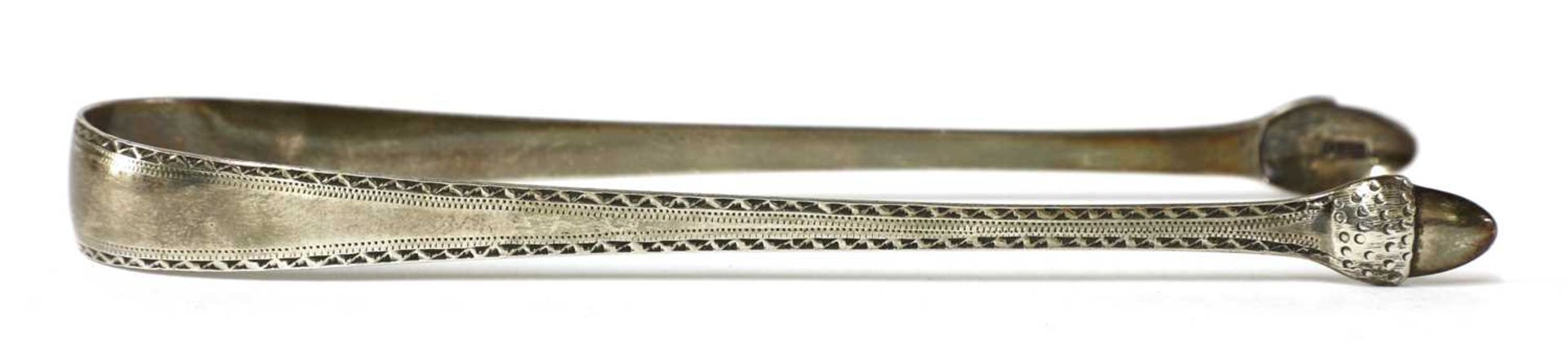 A pair of George III silver sugar tongs, - Image 18 of 33