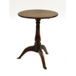An oak tripod table,