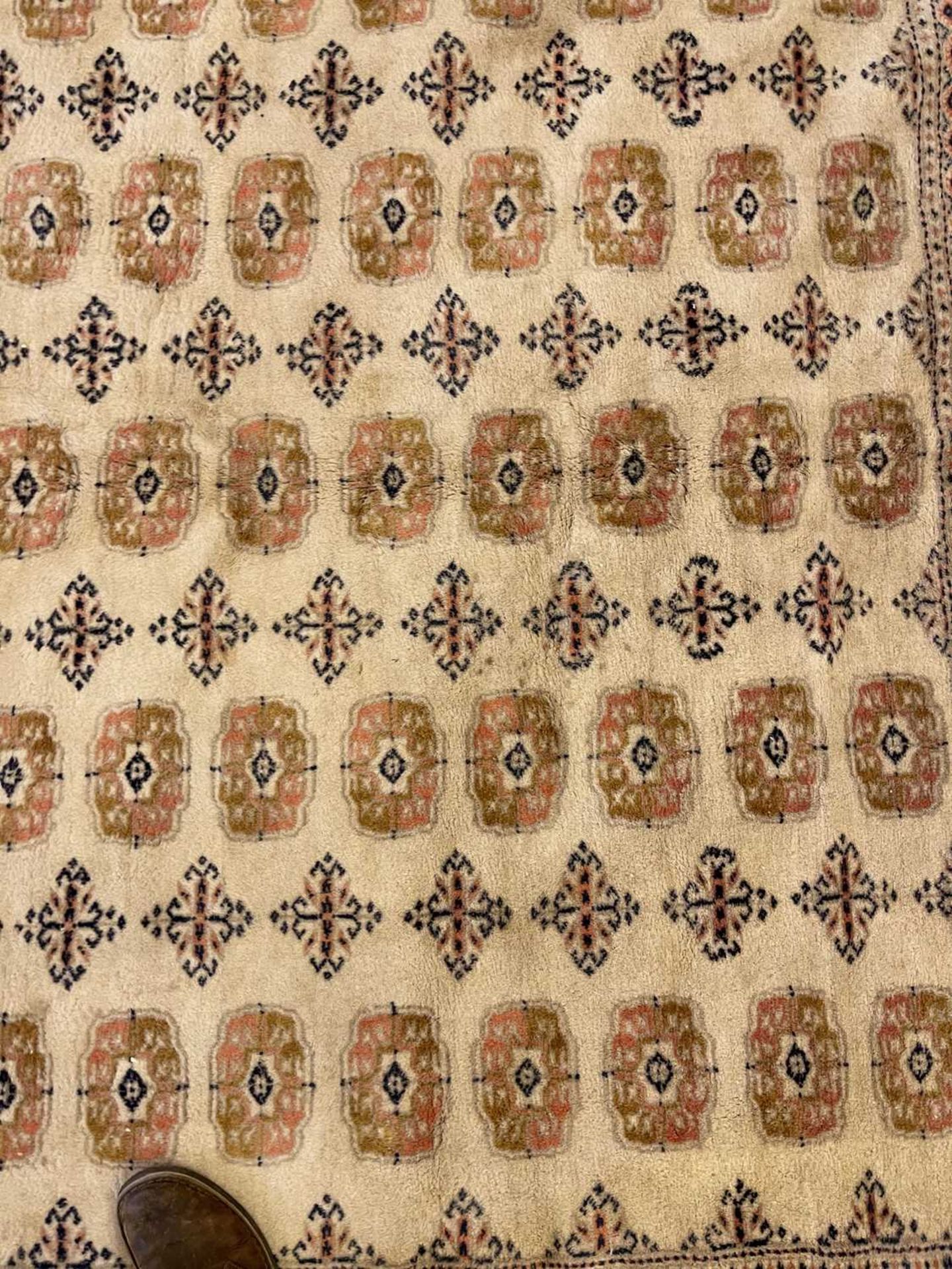 A Bokhara design carpet, - Image 6 of 13