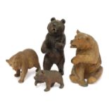 Four carved wooden Black Forest bears,