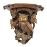 A Black Forest carved softwood wall bracket,